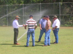 an image of irrigation students out on a field, listening to a lecture.
