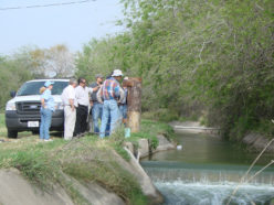 An image of IDEA Program associates next to a river.